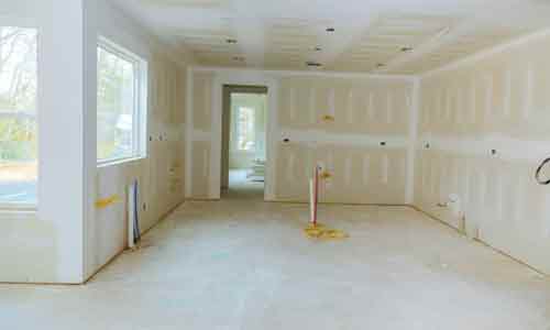Drywall being installed in a home